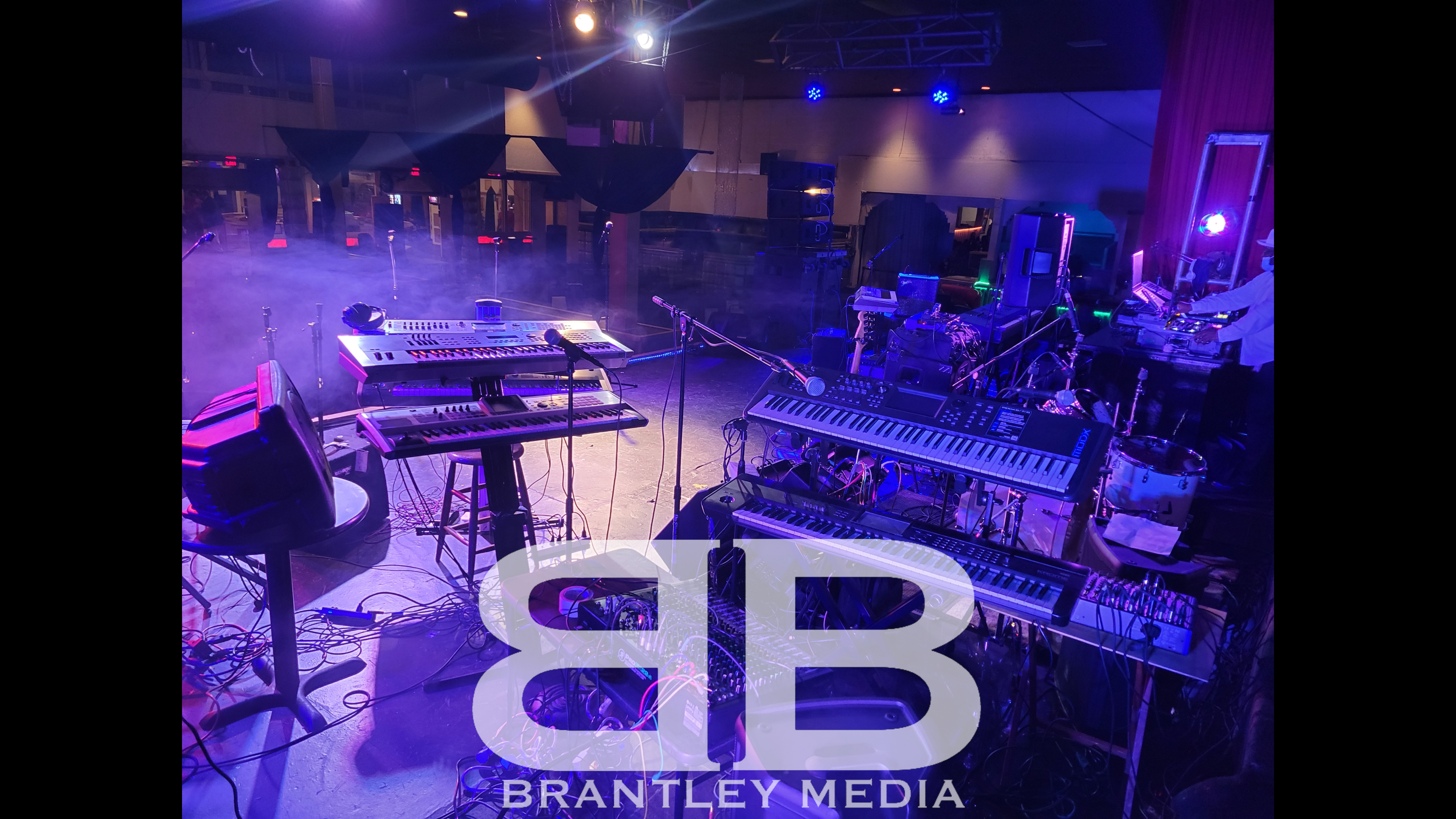 Band equipment on Stage with Brantley Media logo